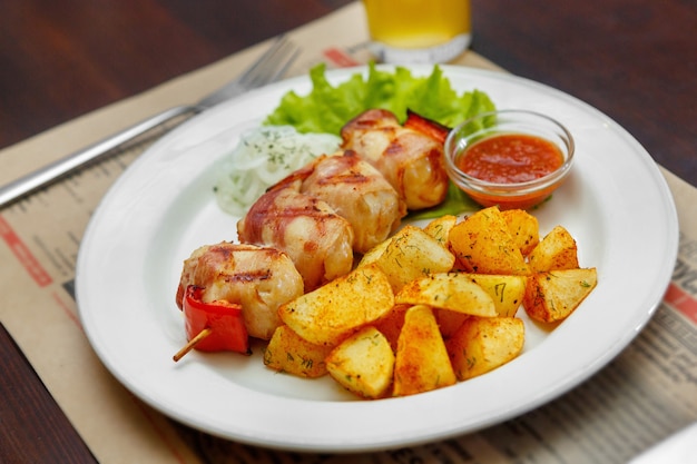 Meat barbecue with fried potatoes