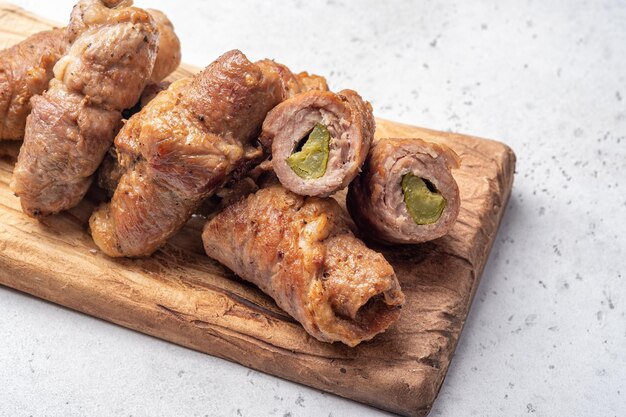 Meat beef rolls stuffed with pickled cucumber