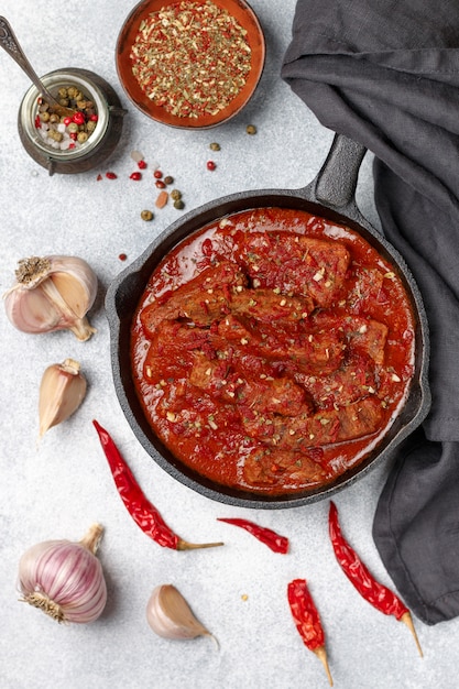 Meat (Beef) stewed in tomato sauce . Goulash