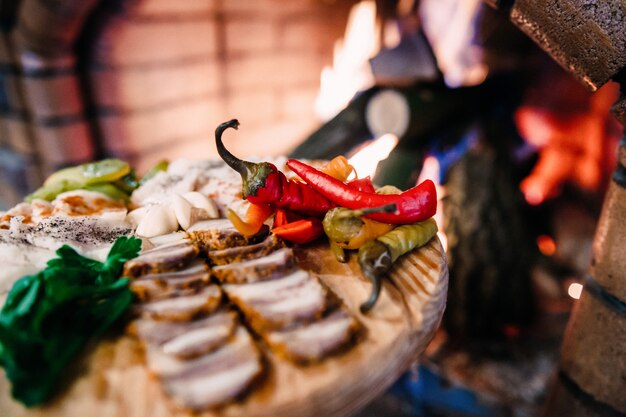 Meat board with Ukrainian lard, pepper and vegetables