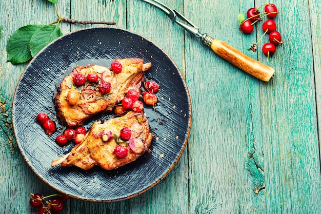 Meat on the bone roasted in berry sauce