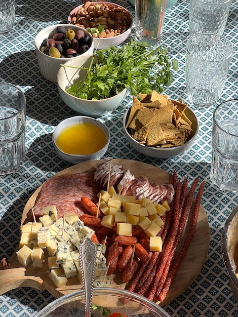 Meat and cheese cuts on a stand on the table