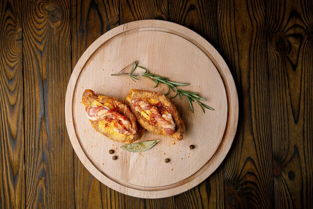 meat culinary products on a wooden board