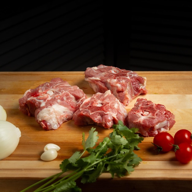 Meat on a Cutting Board with a Black Background