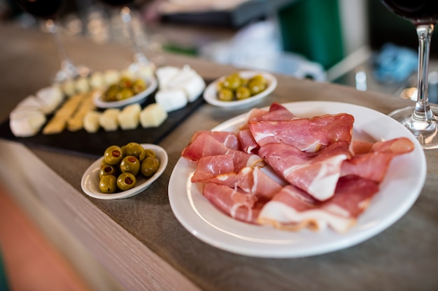 Meat and food on table in restaurant