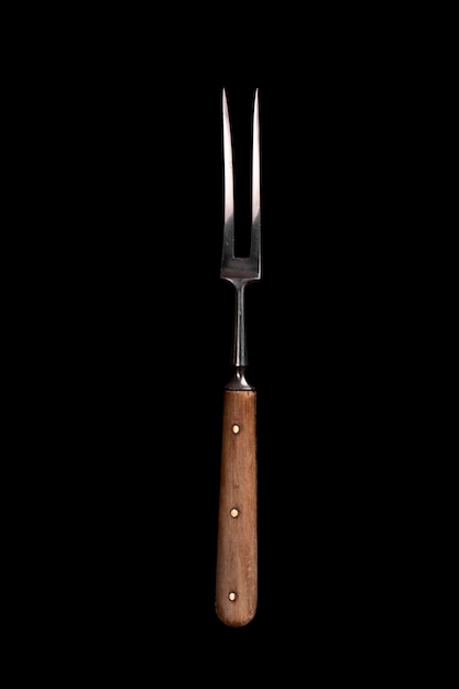 Meat fork isolated on black background