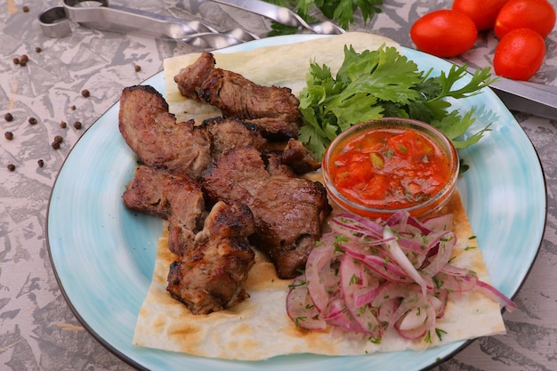 meat kebab is a national dish grilled meat on coals with sauce for the menu highquality photo