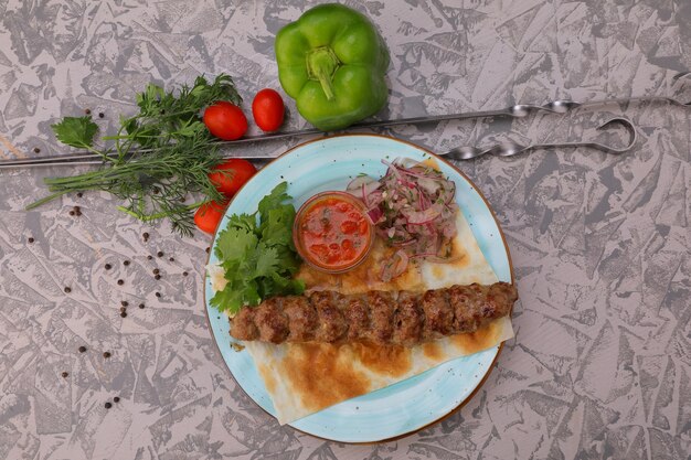 meat kebab is a national dish grilled meat on coals with sauce for the menu highquality photo