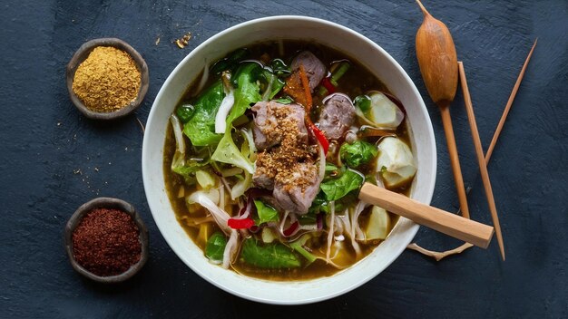 Photo meat lahmajun soup salad spices side view