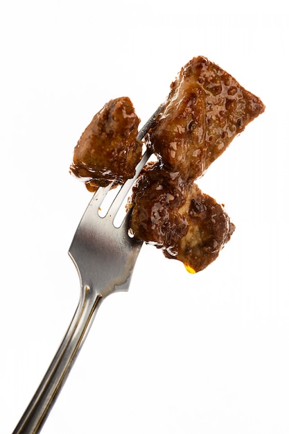 Meat meal on fork isolated