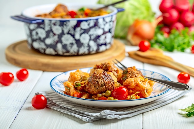 Meat meatballs with stewed vegetables