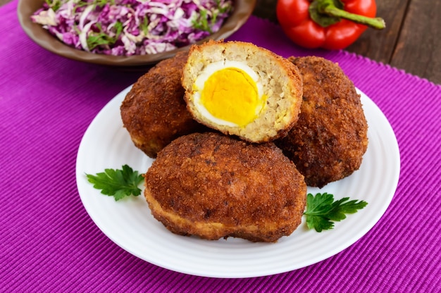 Meat mini-rolls with boiled egg. Close up