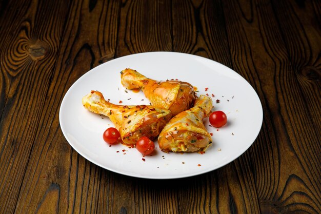 Meat products on a white plate on a wooden table