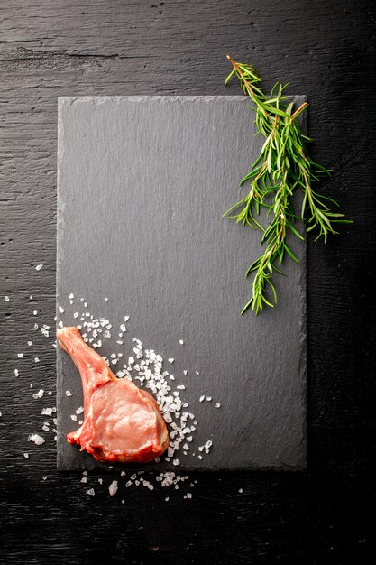 Meat Raw Fresh Mutton on the bone with rosemary 