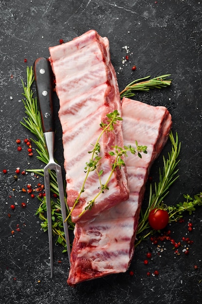 Meat Raw Pork ribs with rosemary Top view Rustic style