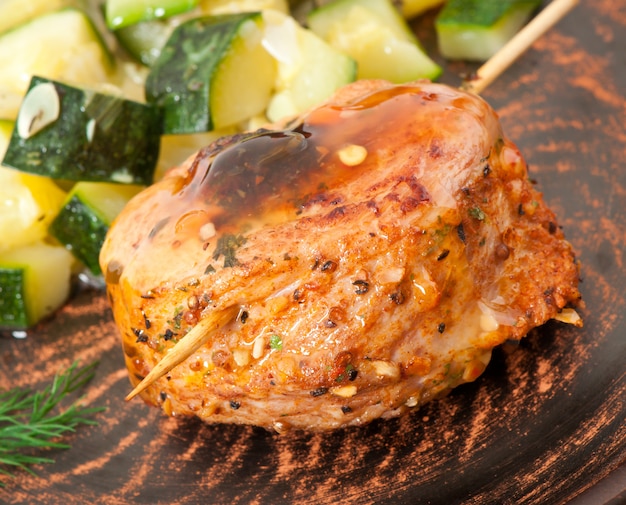 Meat rolls with a side dish of stewed zucchini