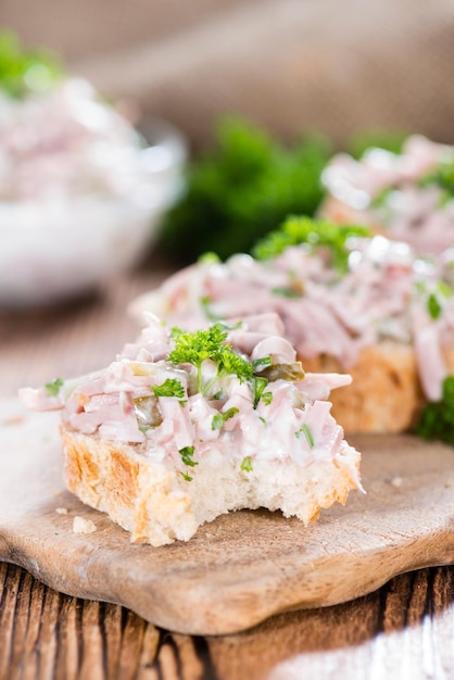 Photo meat salad on a baguette