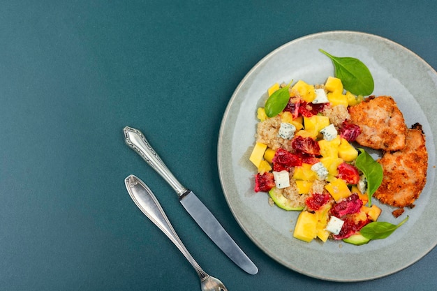 Meat salad with citrus fruits cheese and quinoa