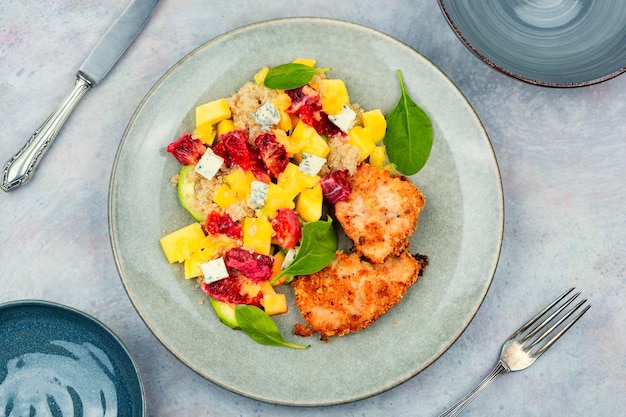 Meat salad with citrus fruits cheese and quinoa