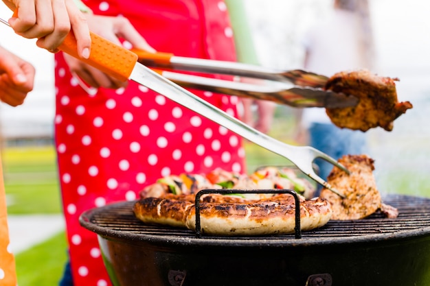 Meat and sausages on BBQ grill