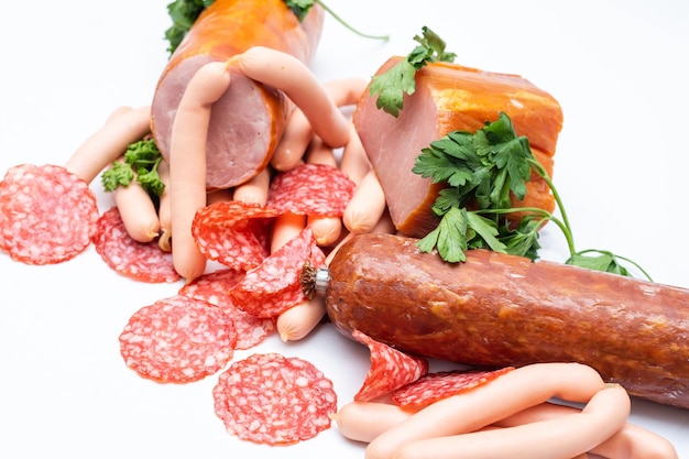 Meat and sausages. Isolated on white.