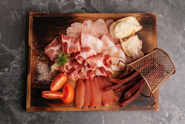 Meat set on a wooden board Snack for beer