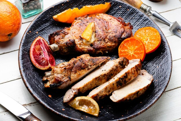 Meat steak fried with citrus fruits