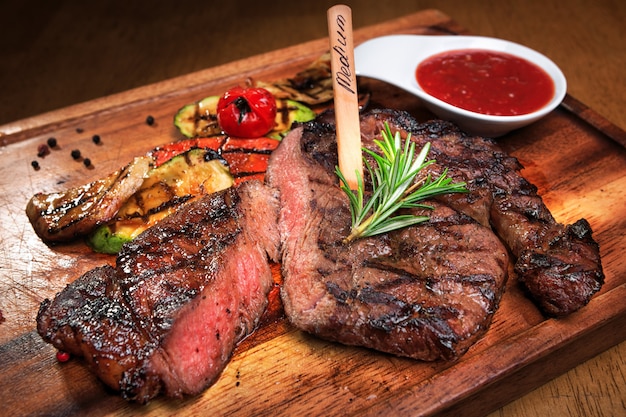 Meat steak on a wooden board