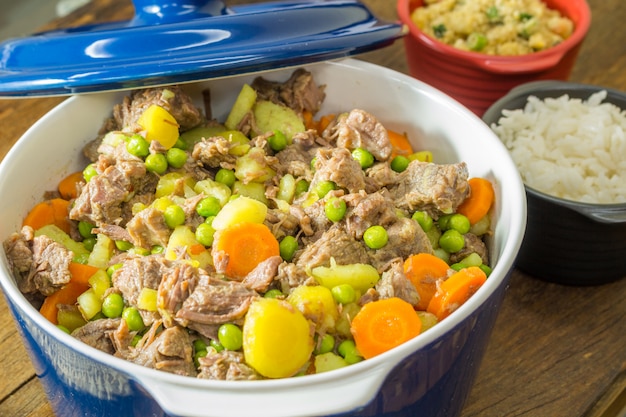 Meat stew with vegetables in bowl.