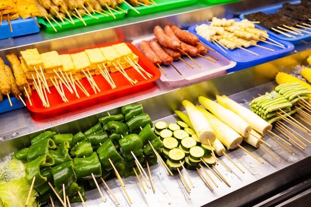 Photo meat and vegetable skewer sell in street market