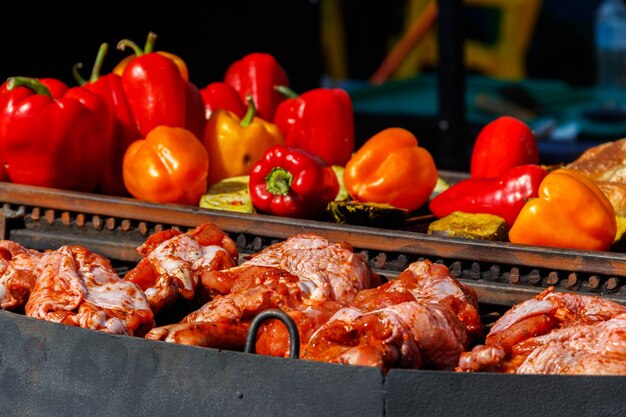 Meat and vegetables cooking on a grill