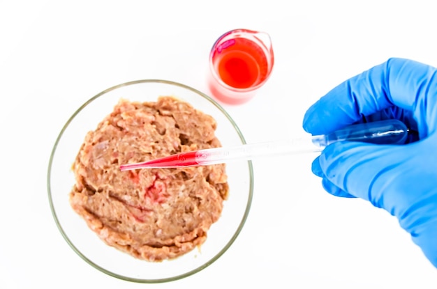 Meat on a white background. experiments, chemistry, artificial production