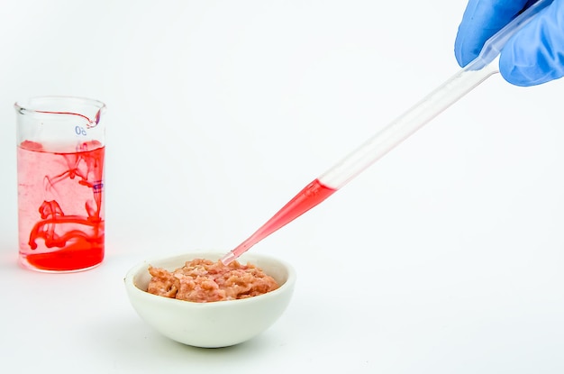 Meat on a white background. experiments, chemistry, artificial production
