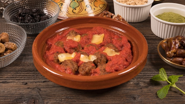 Meat with tomato sauce and dried fruits