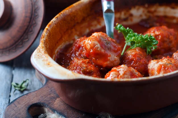 Meatballs in sweet and sour tomato sauce.