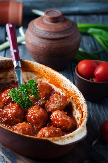 Meatballs in sweet and sour tomato sauce.