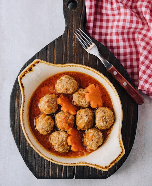 Photo meatballs in sweet and sour tomato sauce
