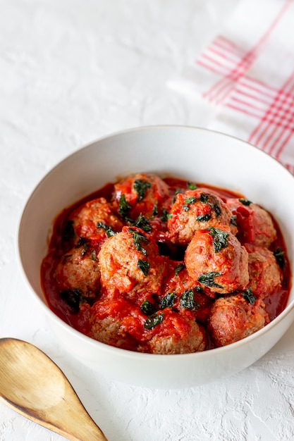 Photo meatballs on a white table. traditional italian cuisine. recipe.