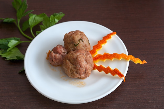 Meatballs with parsley on a plate