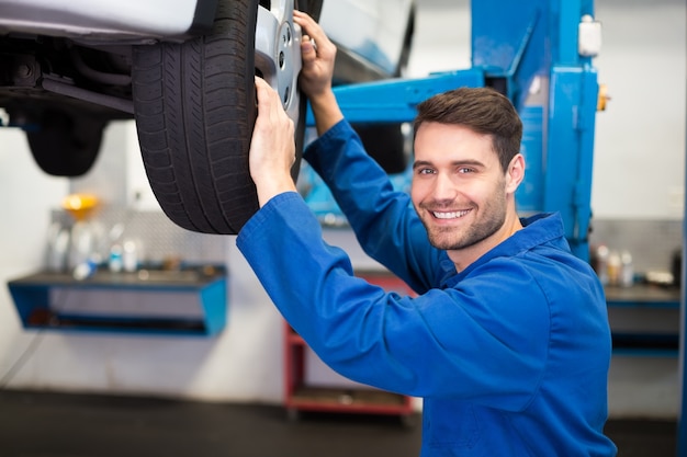 Mechanic adjusting the tire wheel