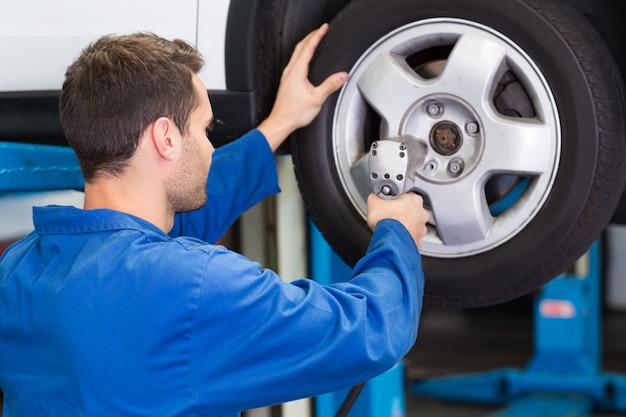 Mechanic adjusting the tire wheel