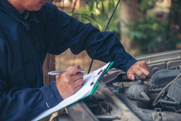 Mechanic car service auto garage in automotive mobile center Technician workshop repair engine motor vehicles service mechanical engineering business Automobile mechanic hands car repairs technic