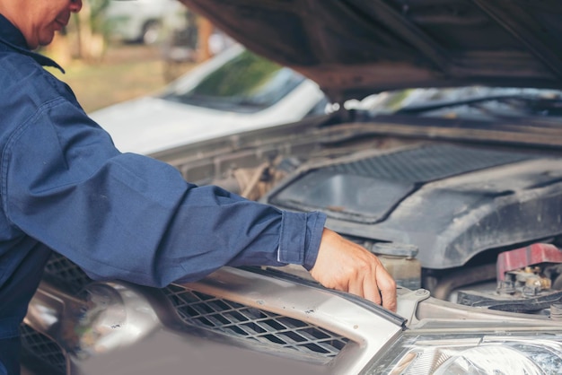 Mechanic car service auto garage in automotive mobile center\
technician workshop repair engine motor vehicles service mechanical\
engineering business automobile mechanic hands car repairs\
technic