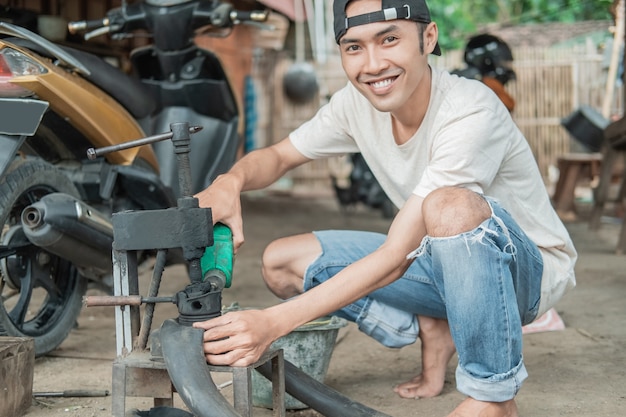 mechanic hand repairing tire at workshop