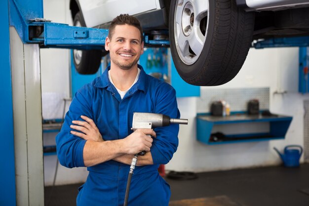 Mechanic holding a drill tool