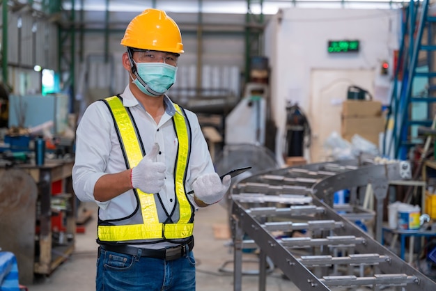 Mechanic man wearing protective mask while working