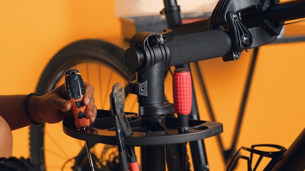 Photo mechanic preparing work tools before starting repairing broken bicycle