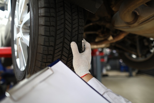 Mechanic in protective gloves