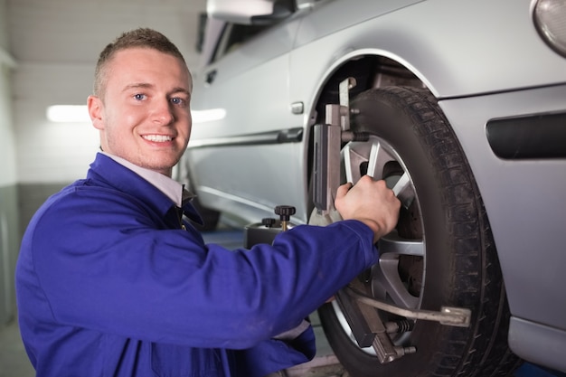 Mechanic repairing a car wheel