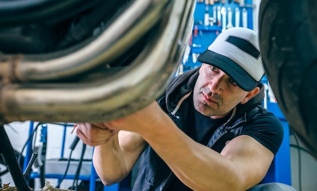 Mechanic repairing customized motorcycle